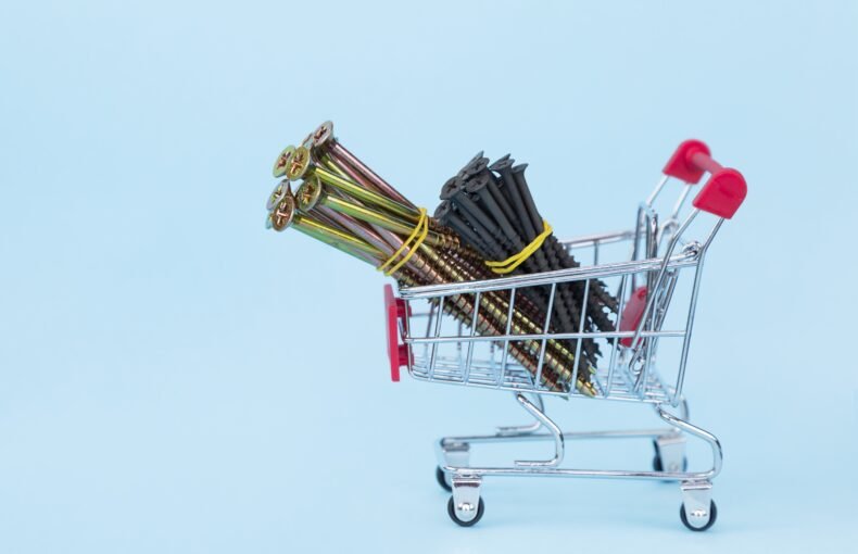 nails-and-screws-in-a-grocery-cart-on-a-blue-backg-2025-03-07-00-38-09-utc